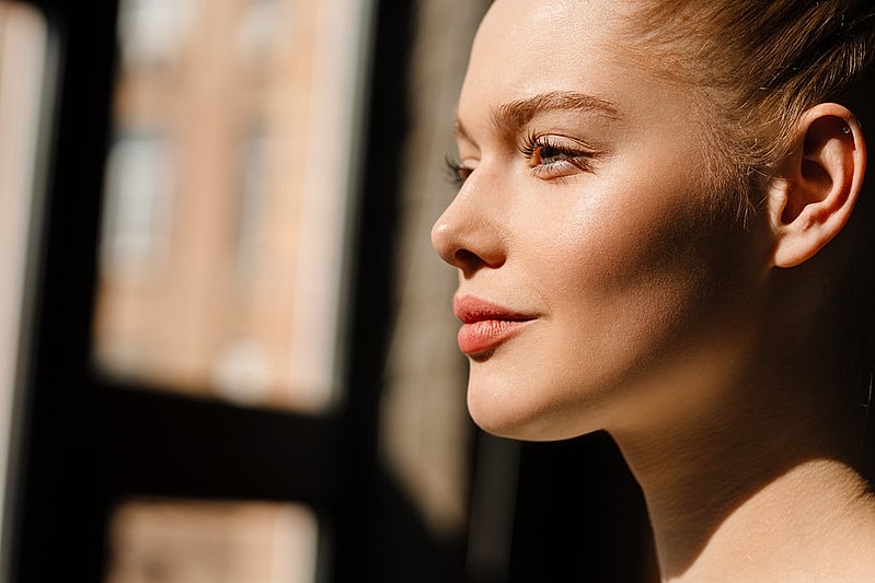 Woman's profile lit by natural light