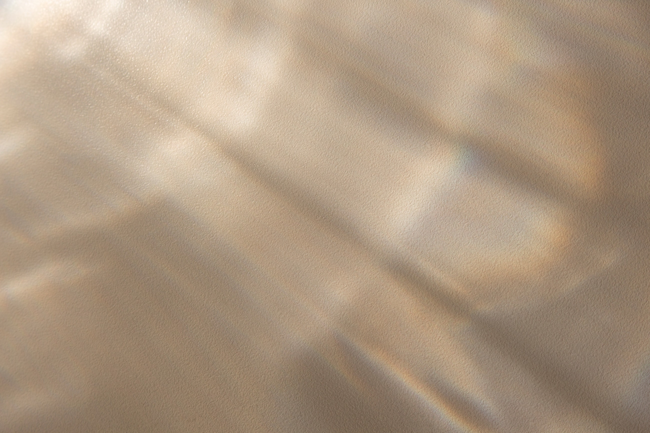 Soft, textured fabric with light reflections.