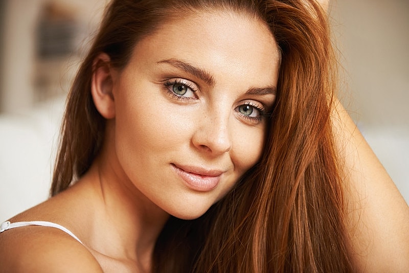 Portrait of woman with long, flowing hair.