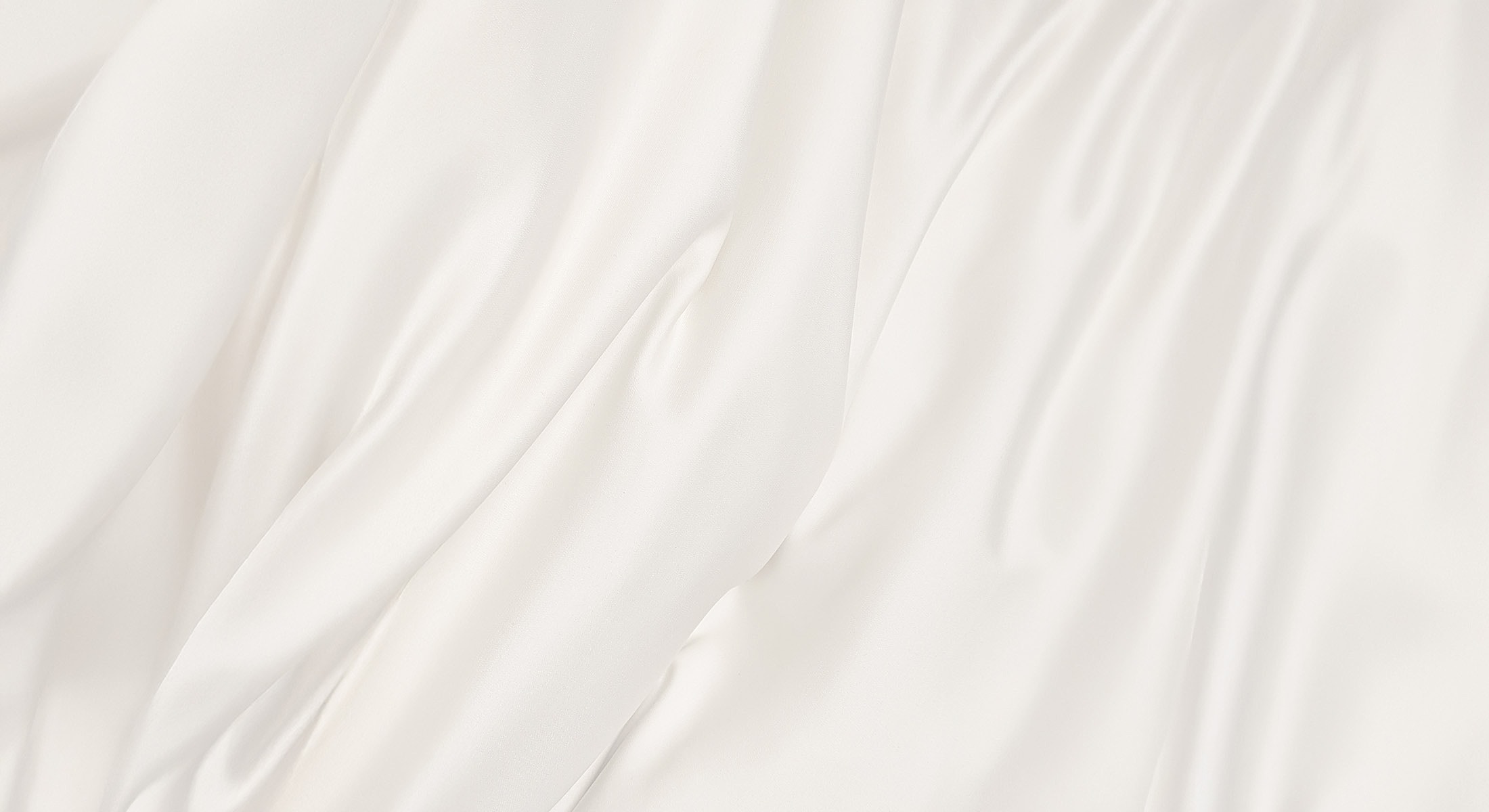 Silky white fabric with soft draping texture.