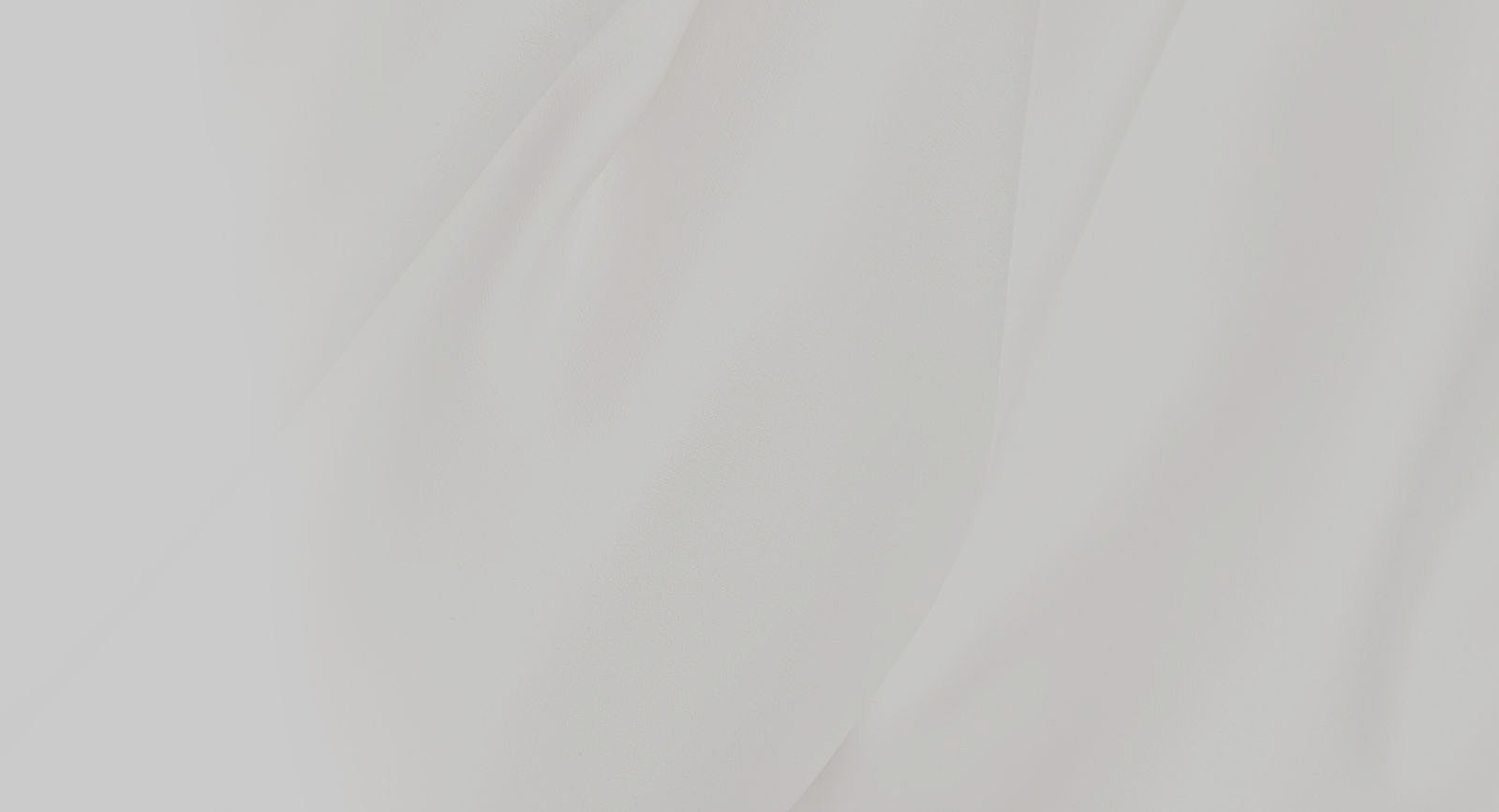Smooth white fabric texture close-up.