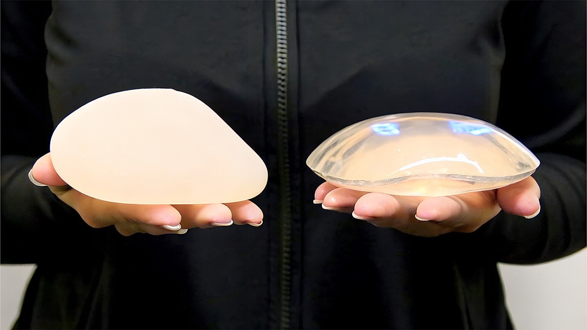 Silicone breast implants in hand comparison.