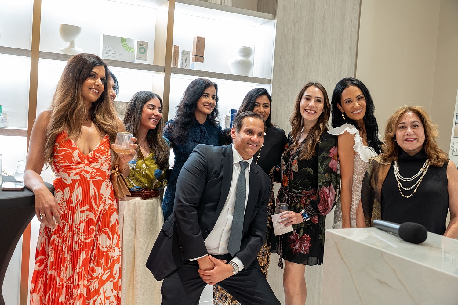 Group of people posing at an event.