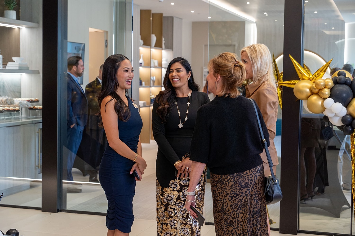 Women chatting at a social gathering event.