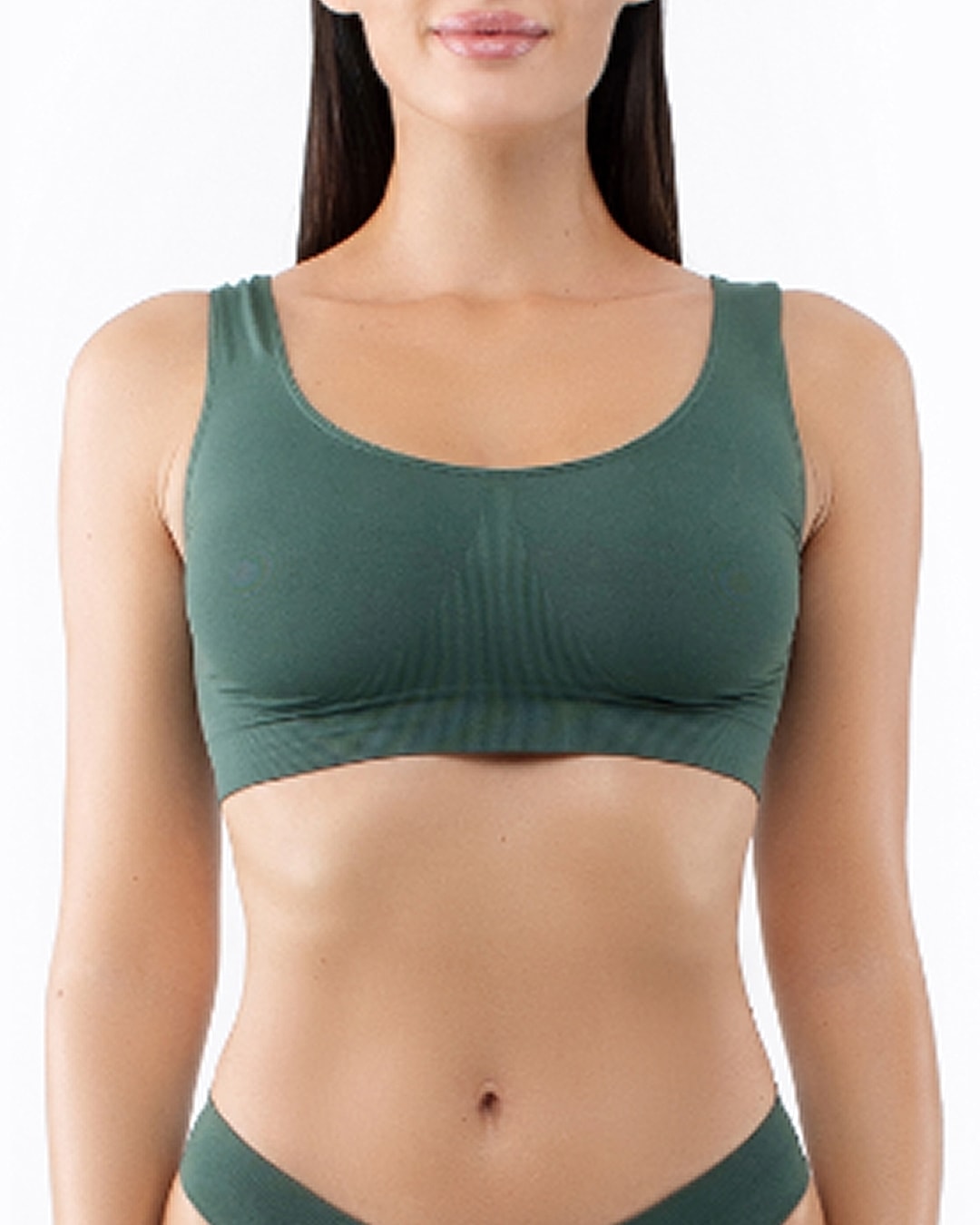 Model wearing a green sports bra.