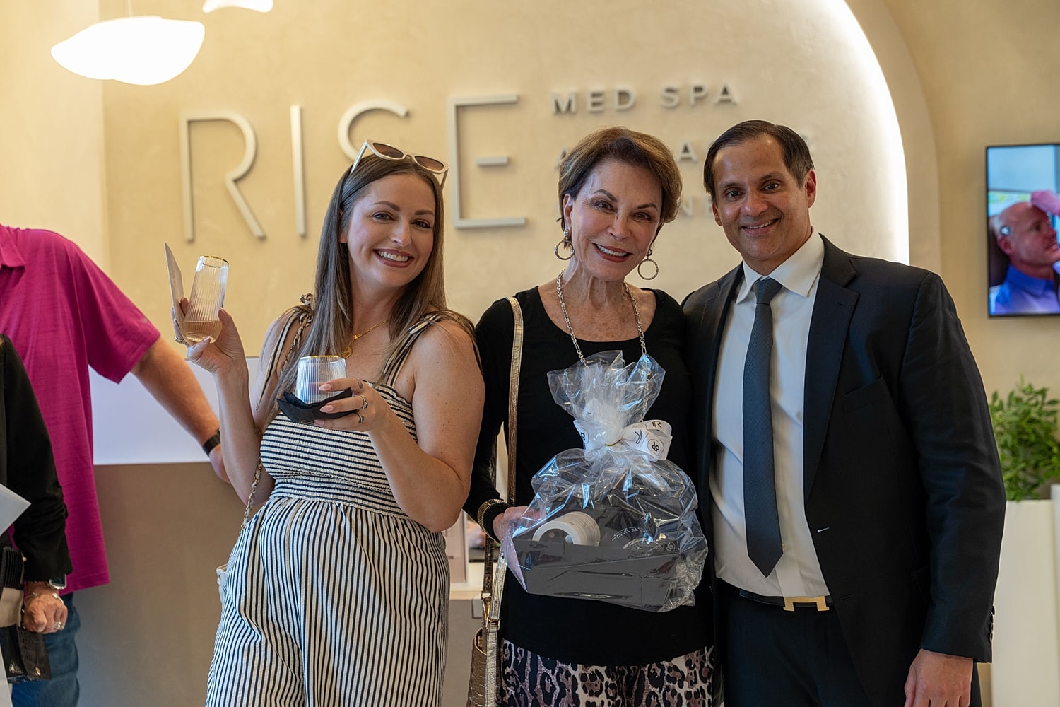 Guests celebrating at RISE Med Spa event.