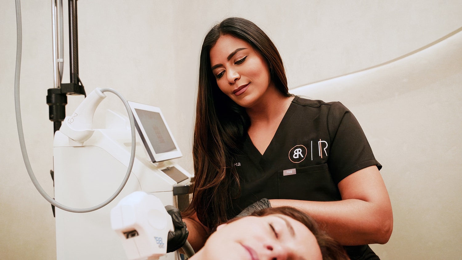 Medical professional performing a treatment on a patient.