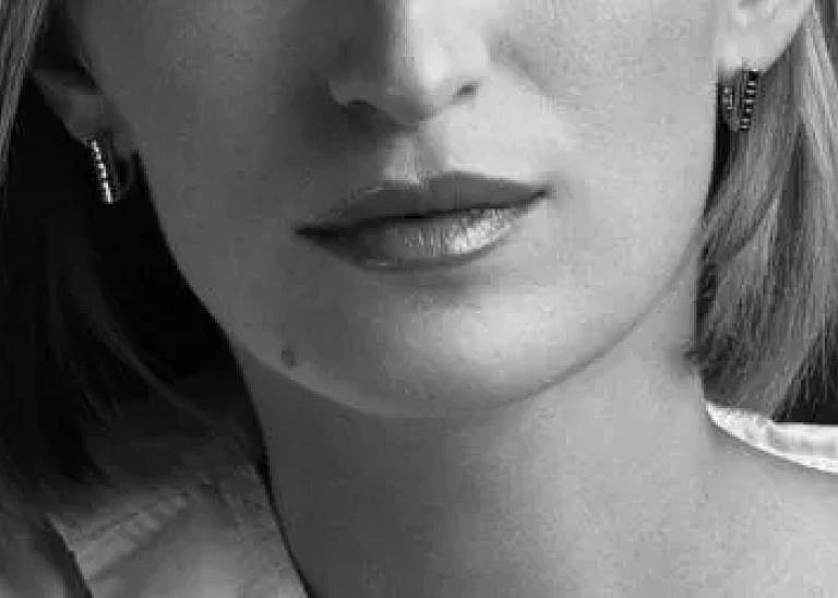 Close-up of woman's face in black and white.