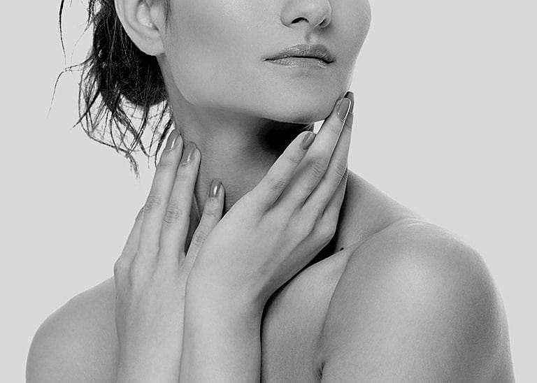 Black and white portrait of a thoughtful woman.