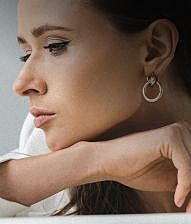 Houston plastic surgery model wearing earrings 