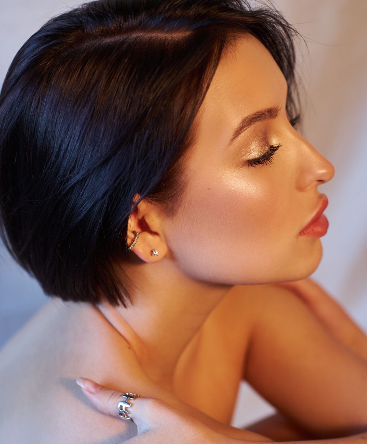 Profile of a woman with stylish short hair.