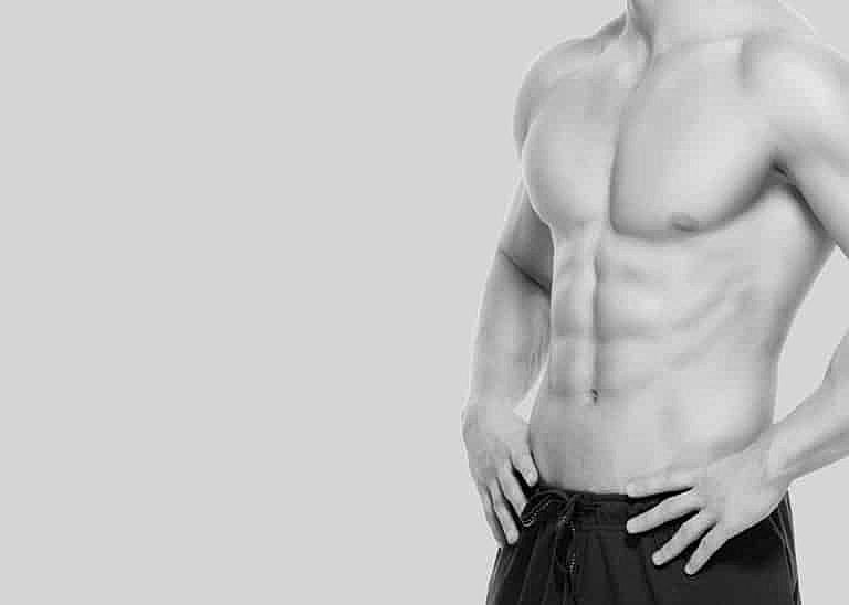 Male model displaying athletic physique and abs.