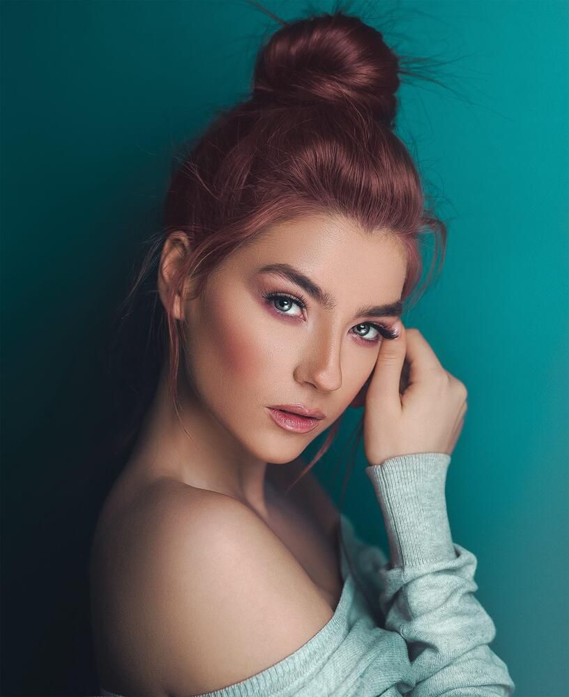 Portrait of a woman with stylish bun hairstyle.
