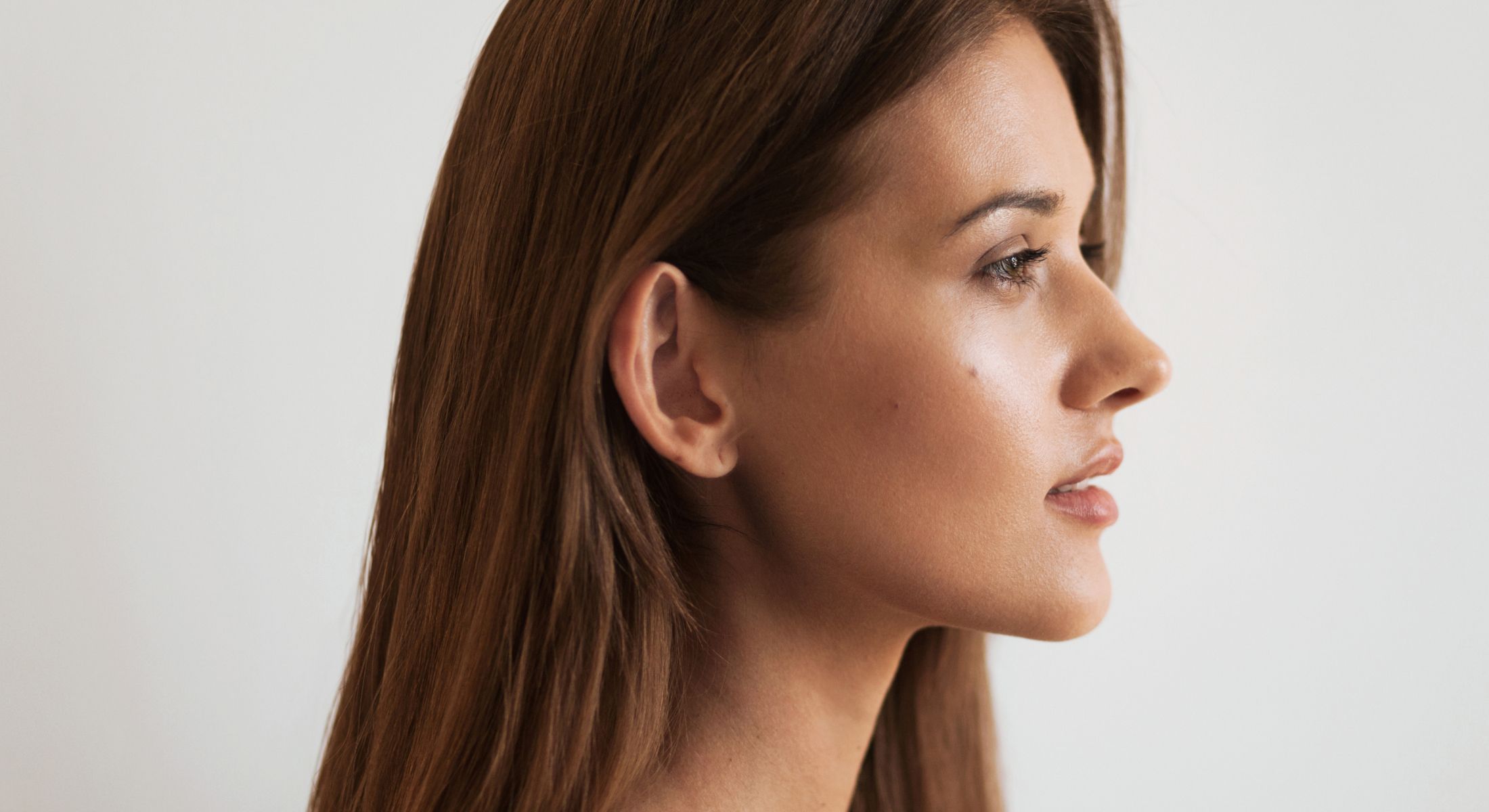 Profile view of a woman with long hair.