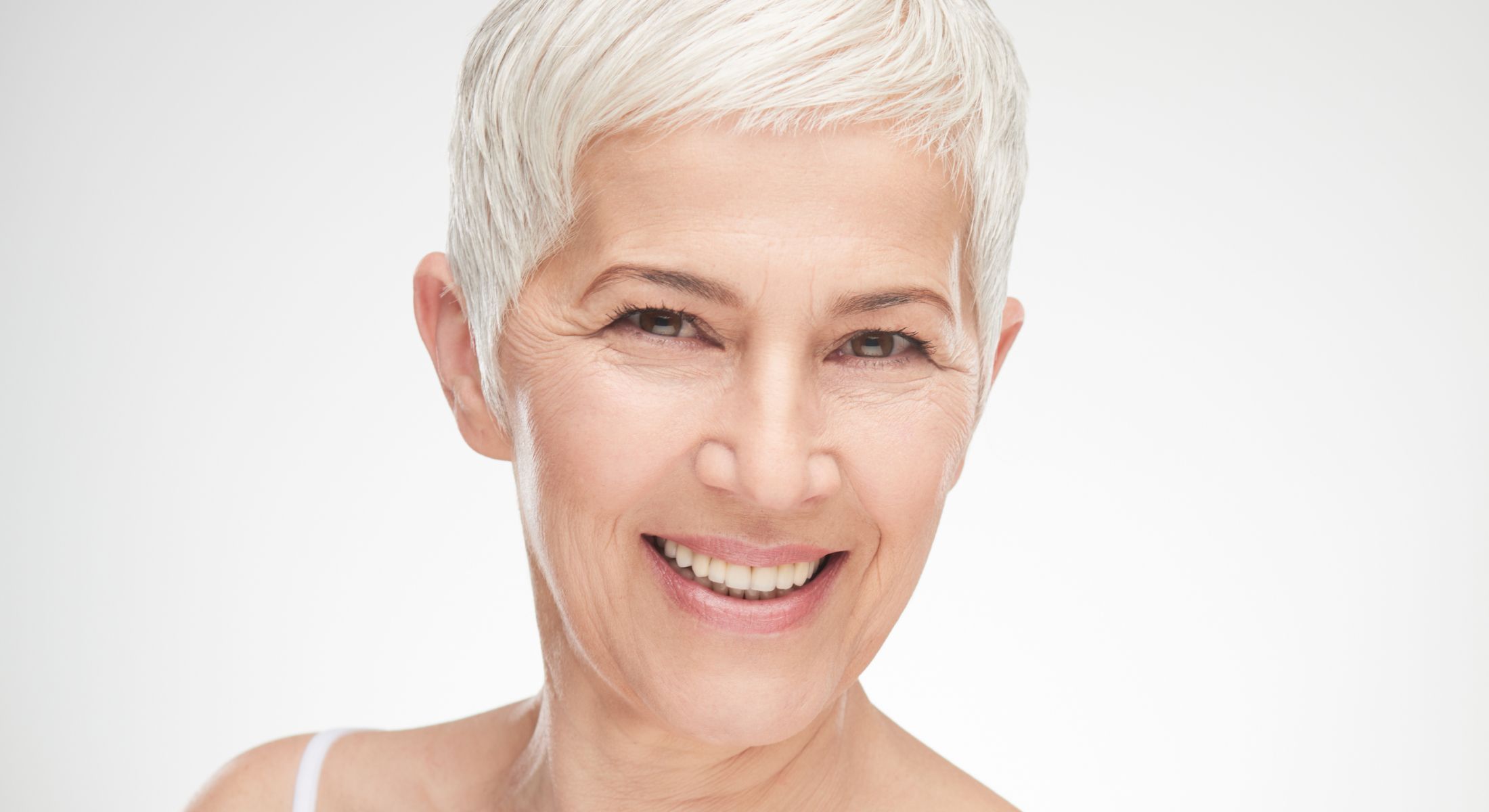 Smiling older woman with short gray hair