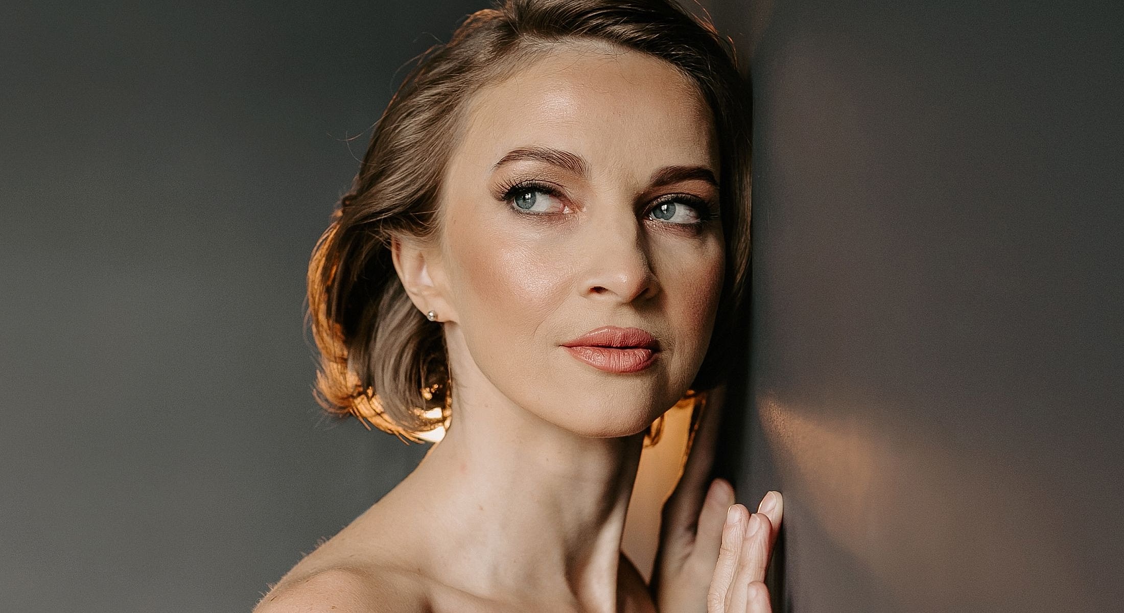 Houston Sculptra model with blue eyes