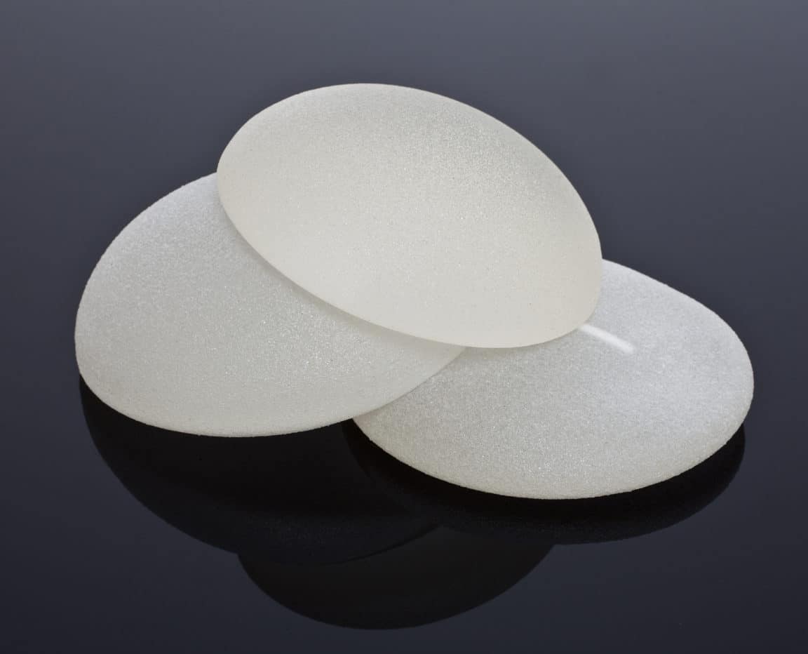 Silicone,Breast,Implants,On,Black,Background,,Silicone,Breast,Implants